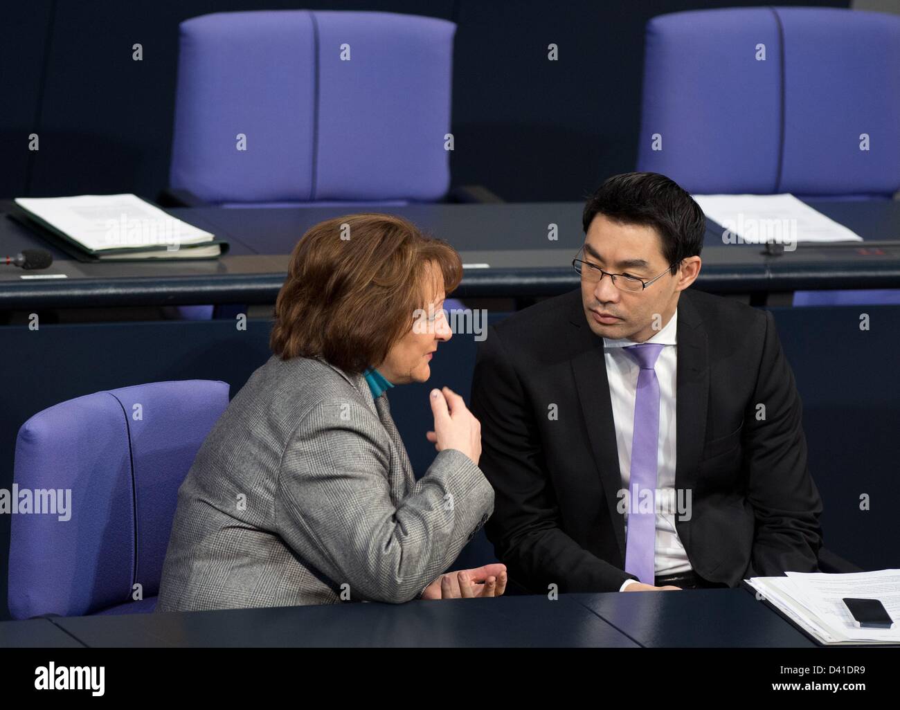 Federal Minister of Economics Philipp Rösler  and Federal Minister of Justice Sabine Leutheusser-Schnarrenberger (both FDP) talk to each other during the parliamentary session in Berlin, Germany, 01 March 2013. Subject of the session was amongst others the intellectual property right. Photo: Soeren Stache Stock Photo