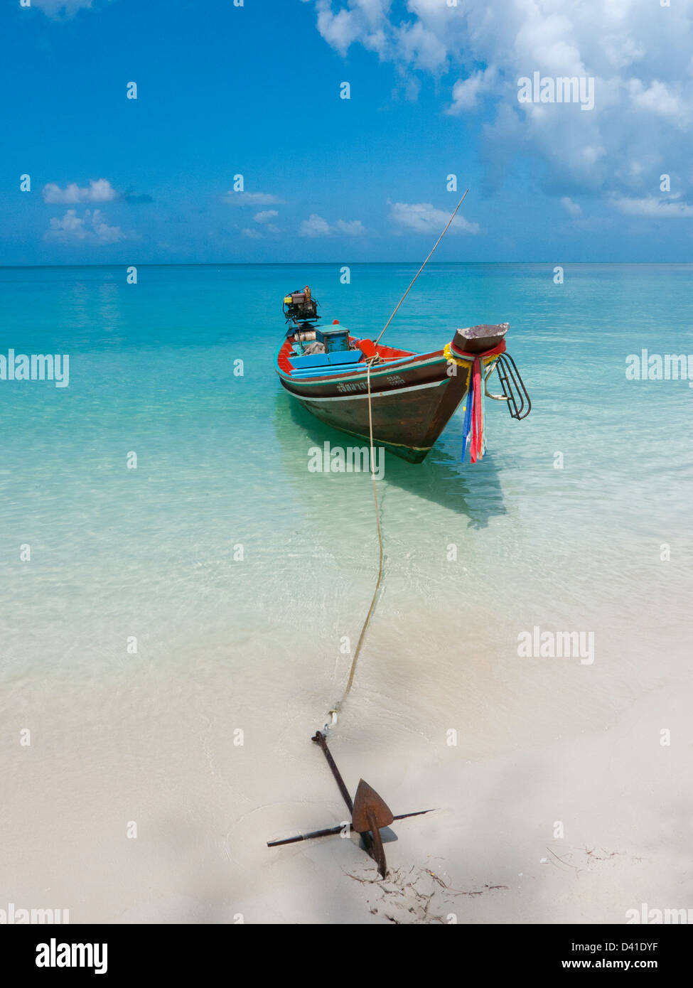 A boat moored on a beach Kohphangan Thailand Stock Photo