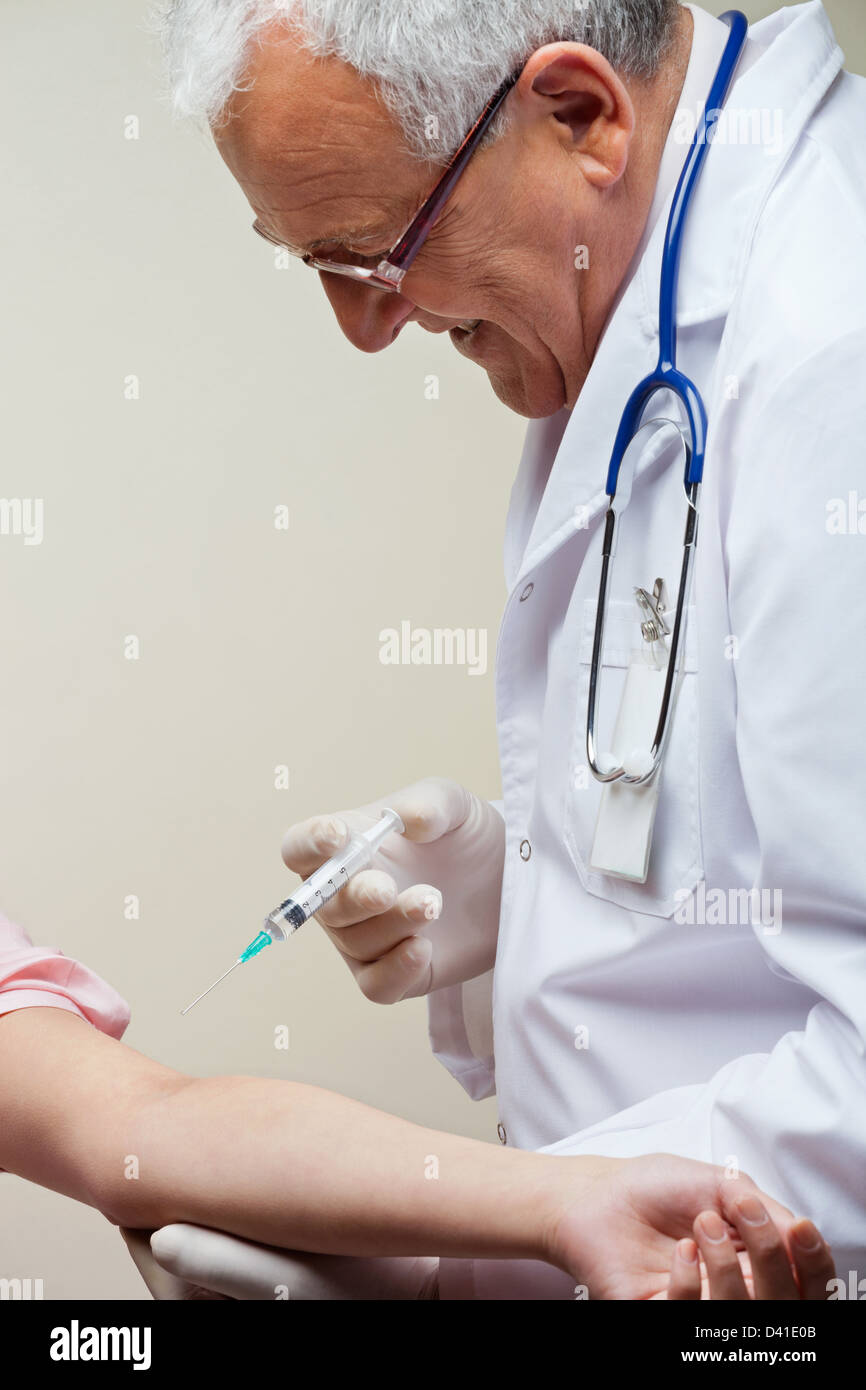 Injection in Arm Stock Photo