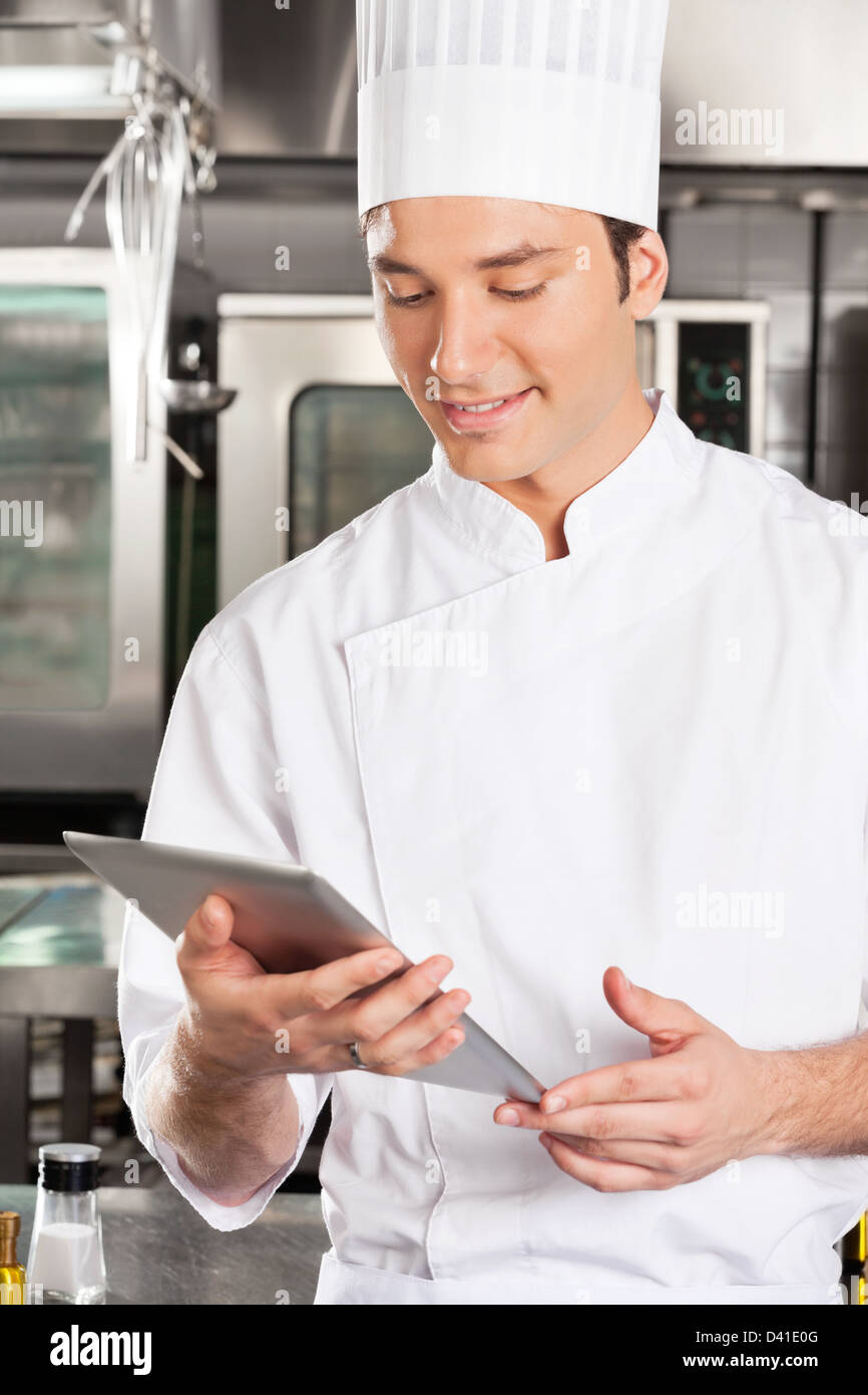 Chef Using Digital Tablet Stock Photo