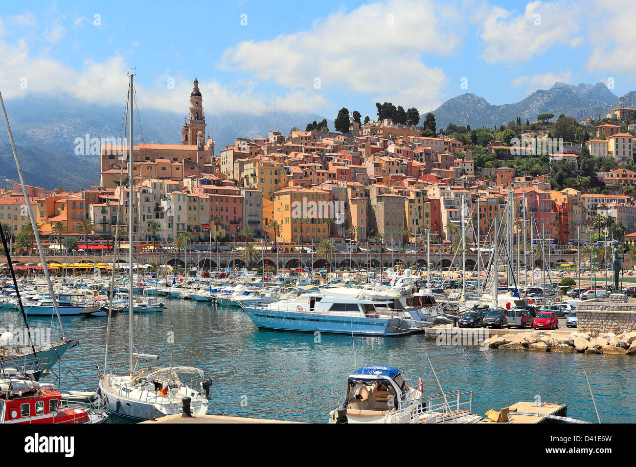 Colorful houses, church and marina with yachts and boats in Menton - town on French Riviera in France. Stock Photo