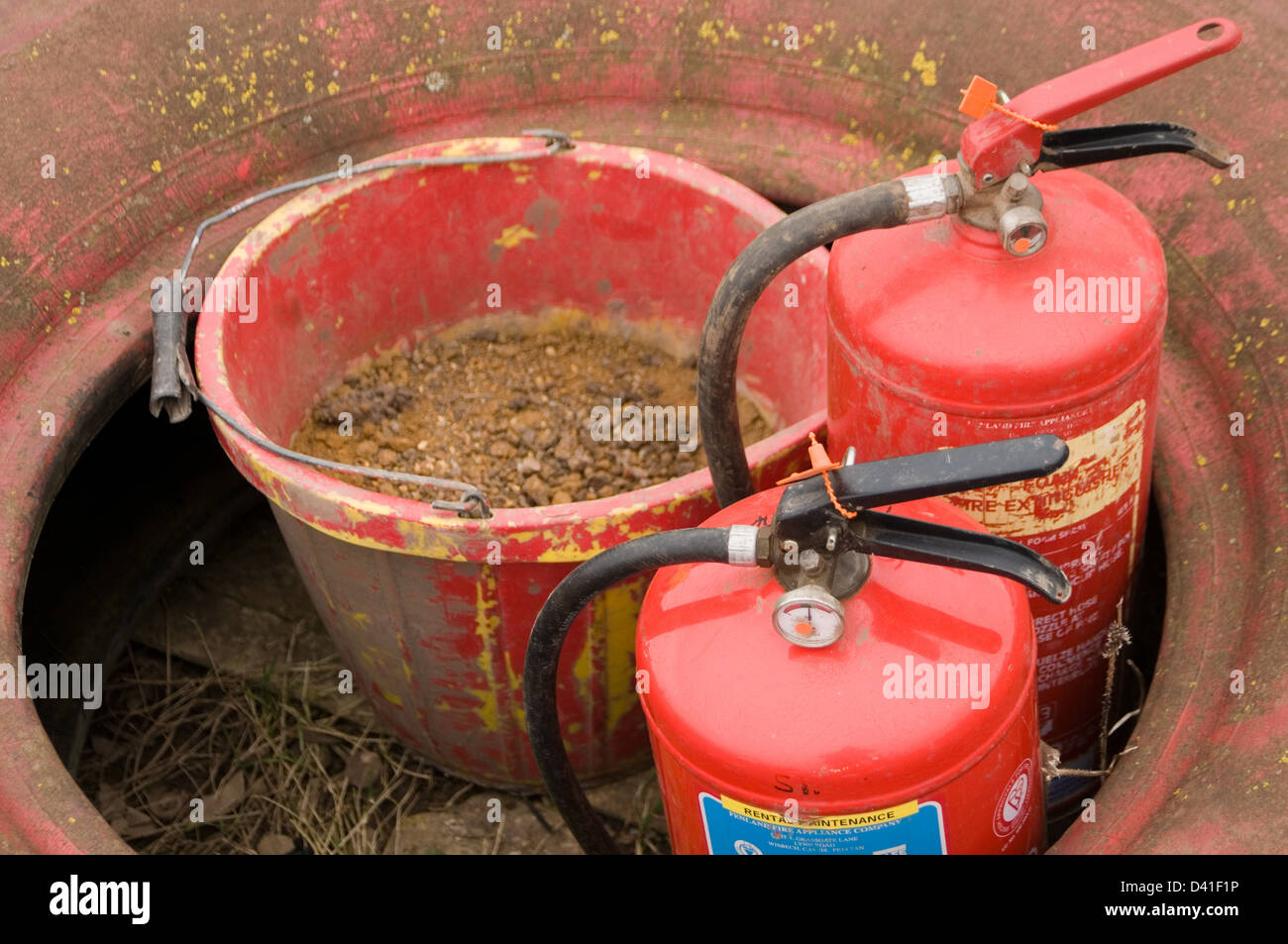 fire extinguishers sand bucket extinguisher emergency fires Stock Photo