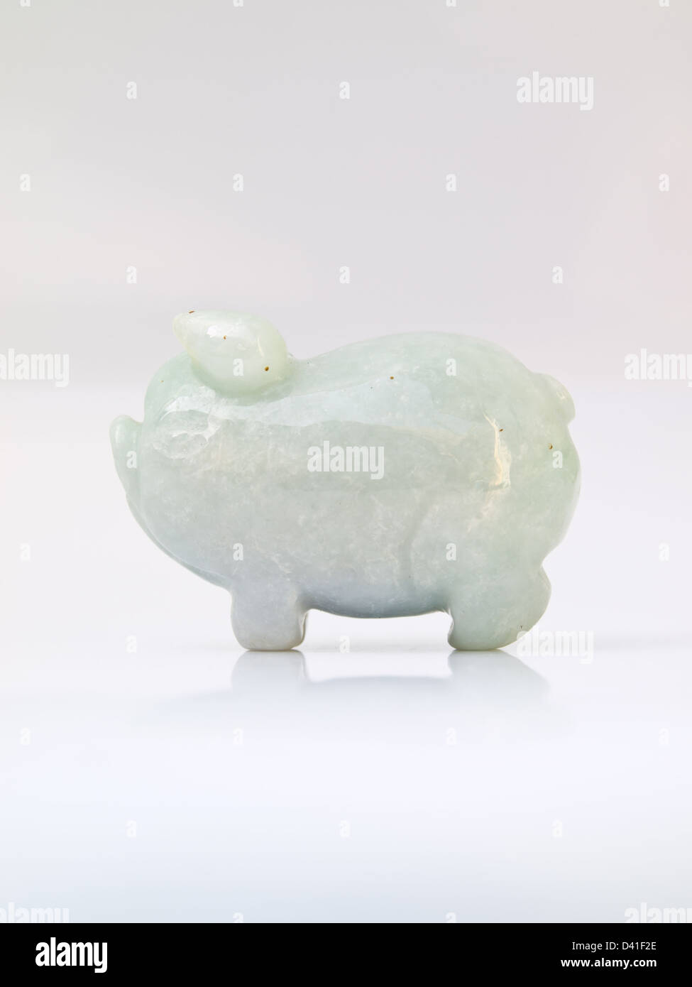 A jade doll pig isolated on white background, handicraft from the Burma Stock Photo