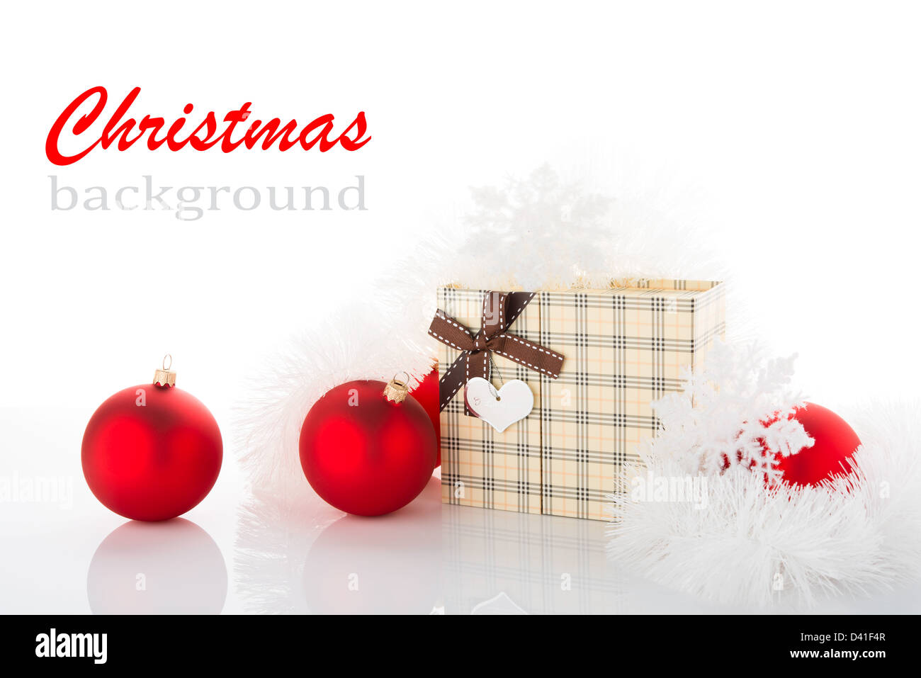 Gift box and Christmas tree decorations on white background Stock Photo ...