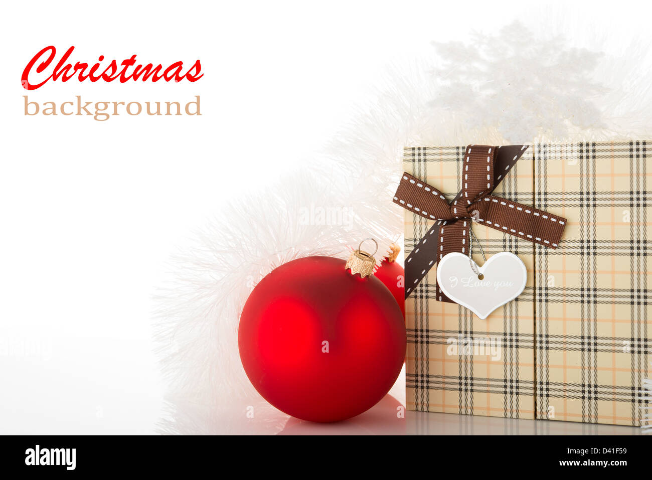 Gift box and Christmas tree decorations on white background Stock Photo ...