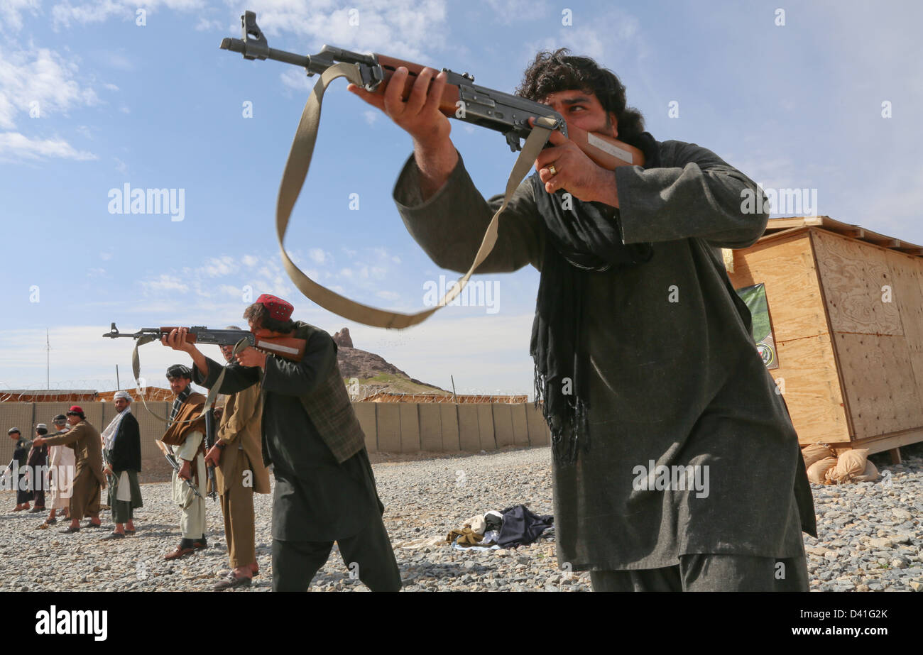 Afghan Local Police officers practice firing AK-47 rifles during training February 17, 2013 in the Arghandab district, Kandahar province, Afghanistan. Stock Photo