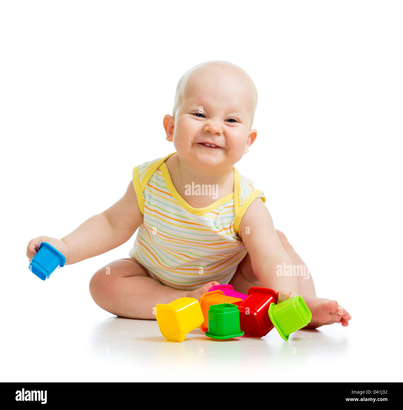 Cute little child is playing with toys isolated over white Stock Photo ...