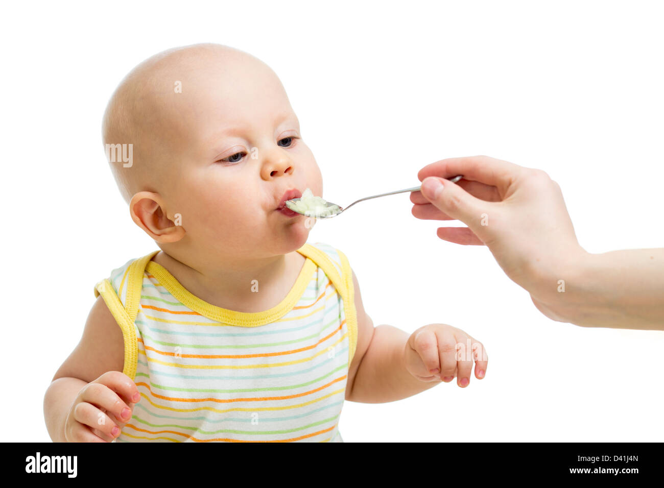 Little baby feeding with a spoon Stock Photo - Alamy