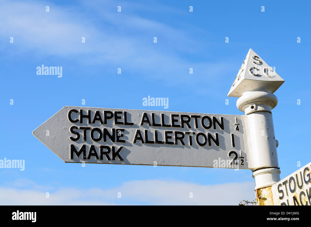 Old style road sign pointing to Chapel Allerton, Stone Allerton and Mark in Somerset, England. Stock Photo