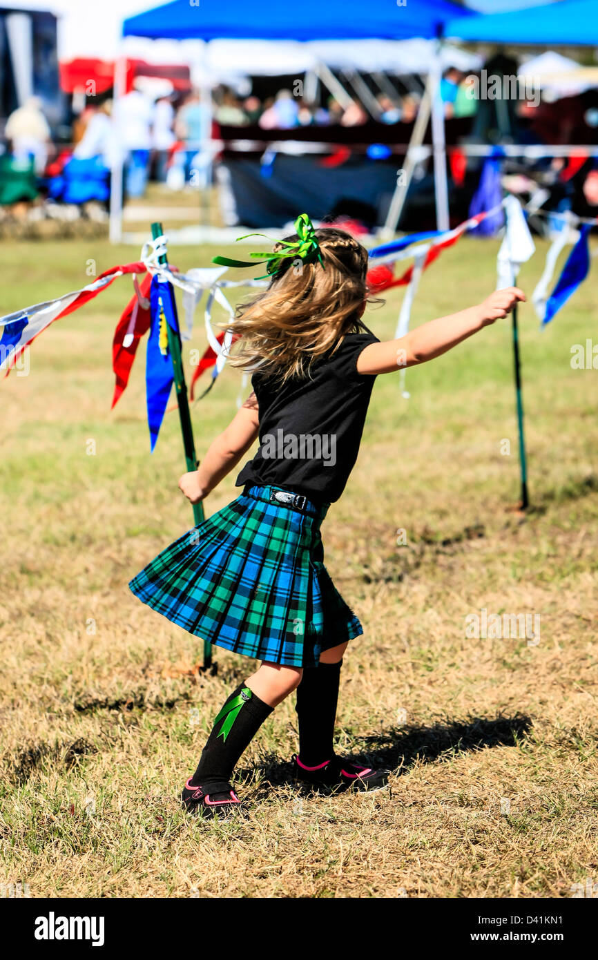 Small female child wearing a kilt at the Sarasota Highland Games Florida, Stock Photo