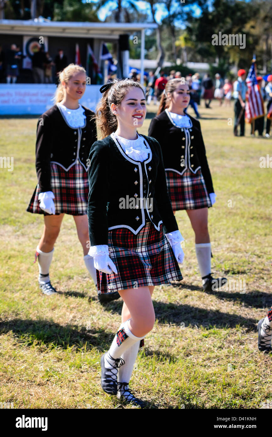 American-Scottish teenage girl dancers march around the arena at the Sarasota Highland Games. Stock Photo