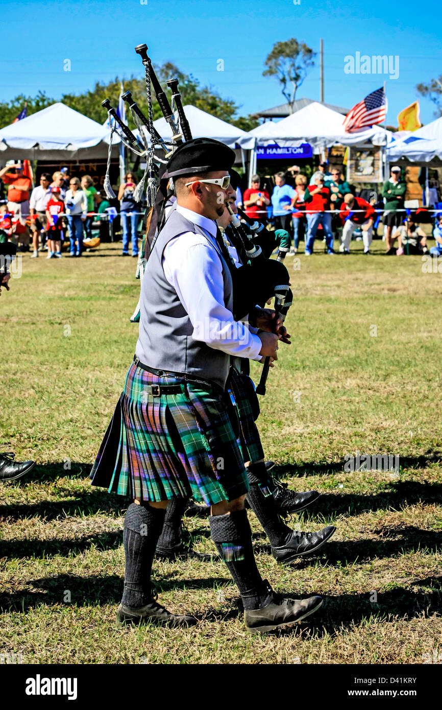 AmericanScottish bagpipe Bandsmen march around the arena at the