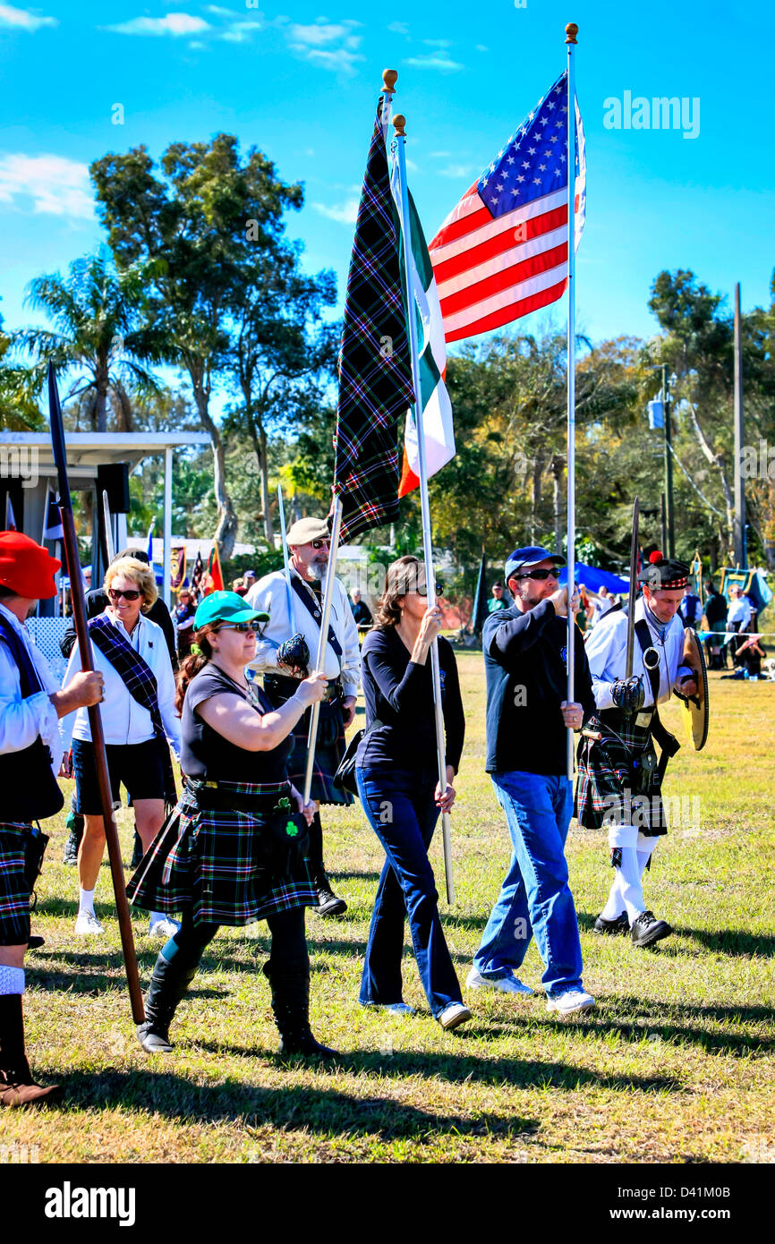 AmericanScottish clans men & women march around the arena at the