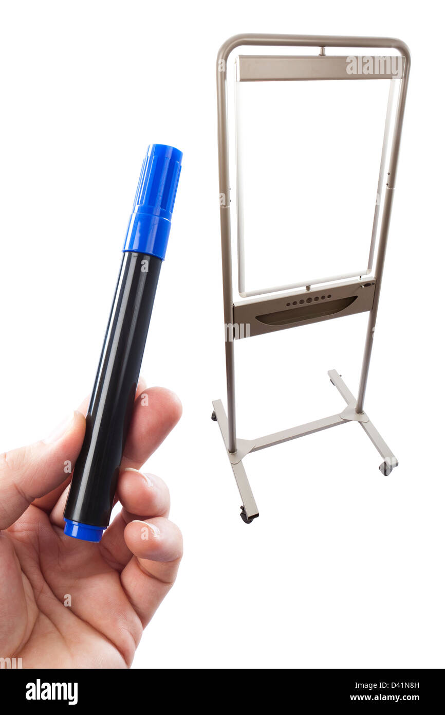 Blue flip chart pen held up in front of a flip chart, combined in post production on a white background. Stock Photo