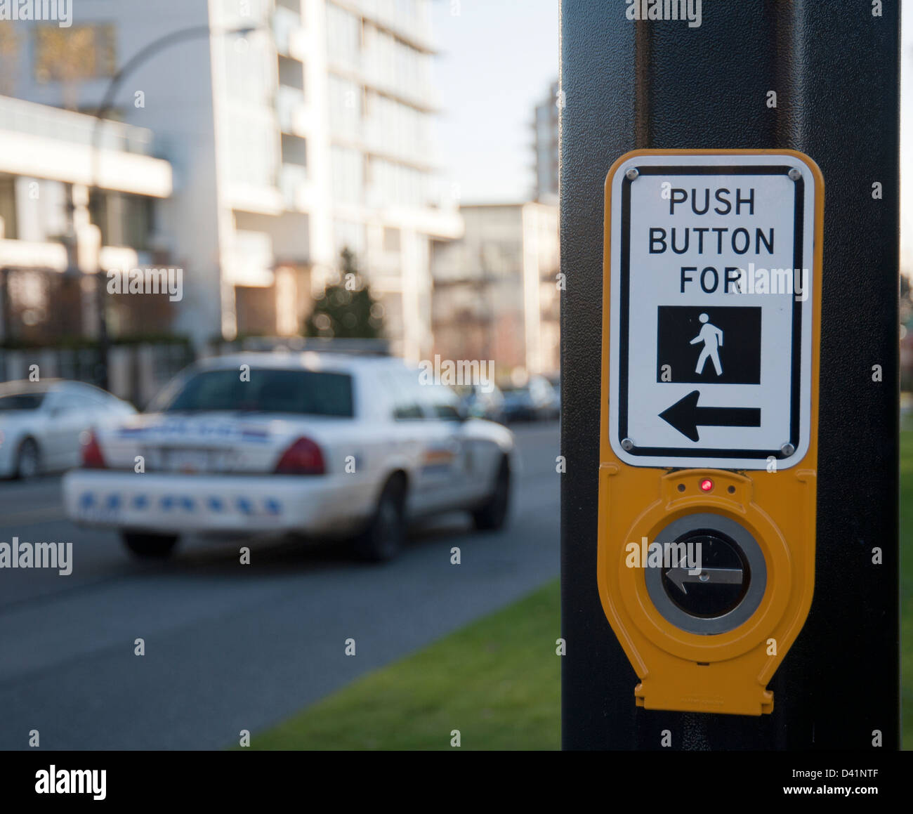 A button on a stop light to push for pedestrians to cross the street safely Stock Photo