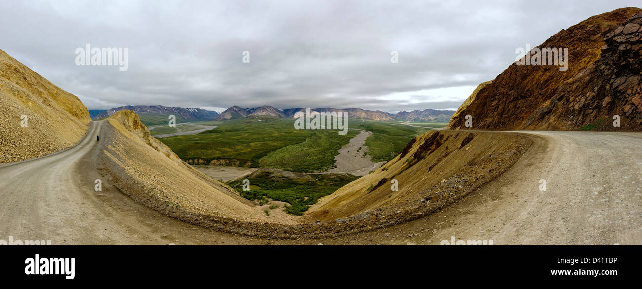 Panorama view of lone hiker, from Polychrome Pass, Denali National Park, Alaska, USA Stock Photo