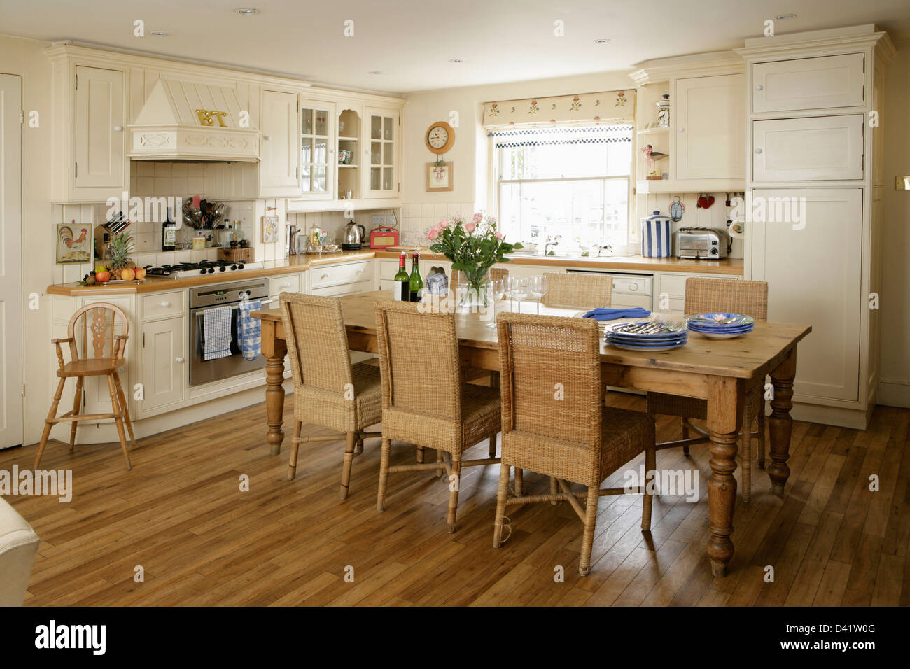 Tall Back Wicker Dining Chairs At Long Pine Table In Country Style Stock Photo Alamy