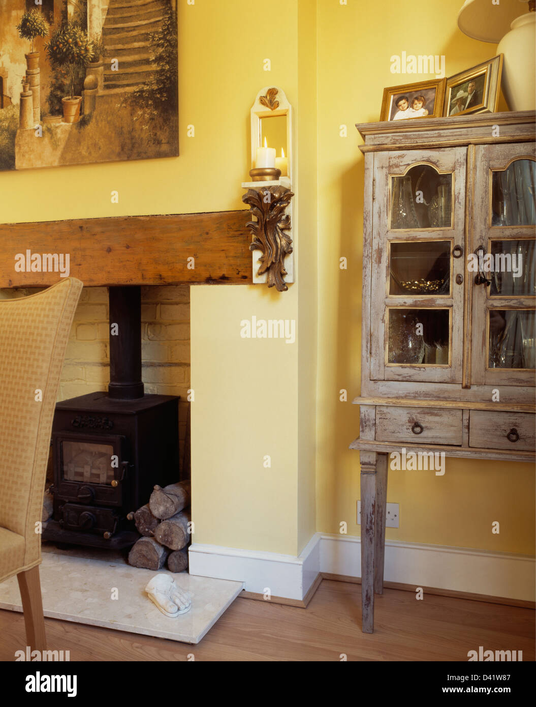 Corbel With Candle On Wall Beside Cast Iron Wood Burning Stove In