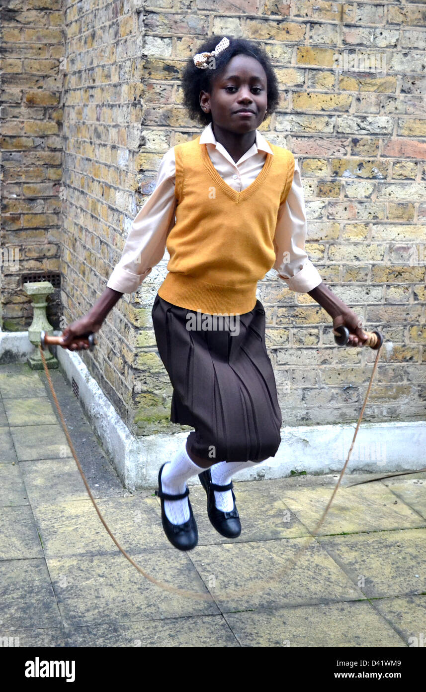 Little girl jumping rope hi-res stock photography and images - Alamy