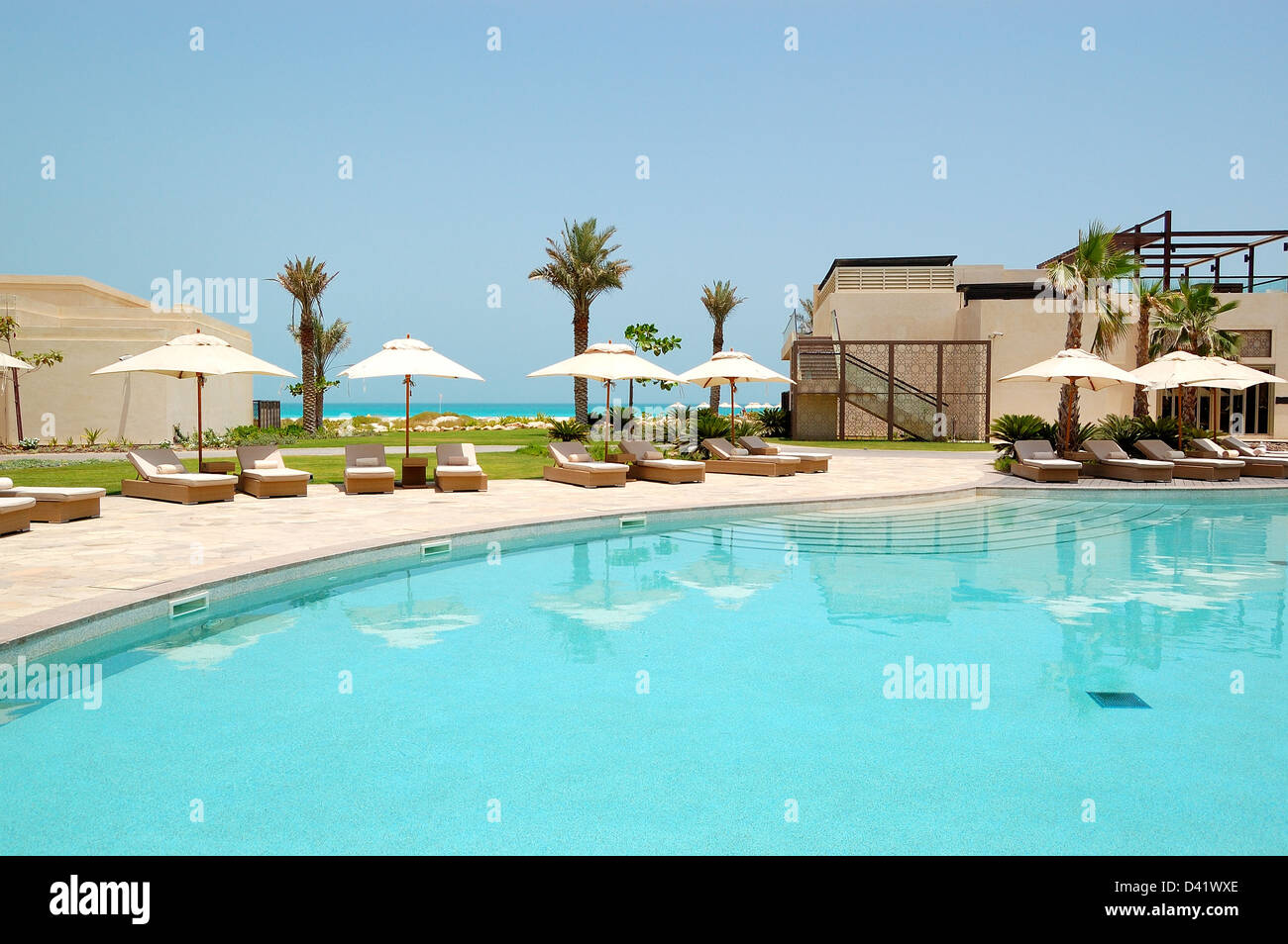 Swimming pools and beach at the luxury hotel, Saadiyat island, Abu Dhabi, UAE Stock Photo