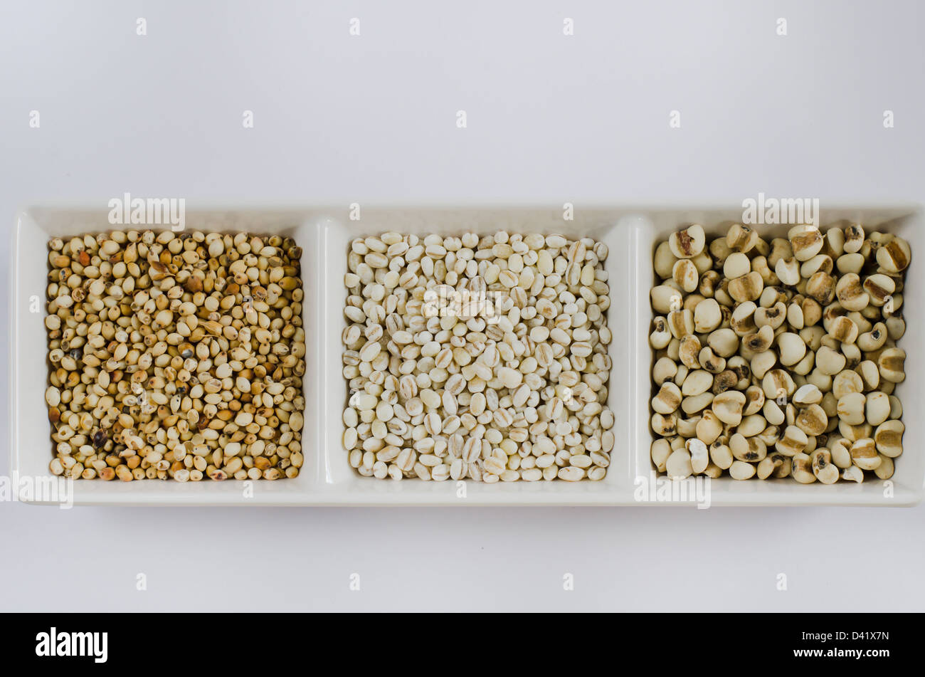 job's tears , barley and millet grains on white bowl Stock Photo