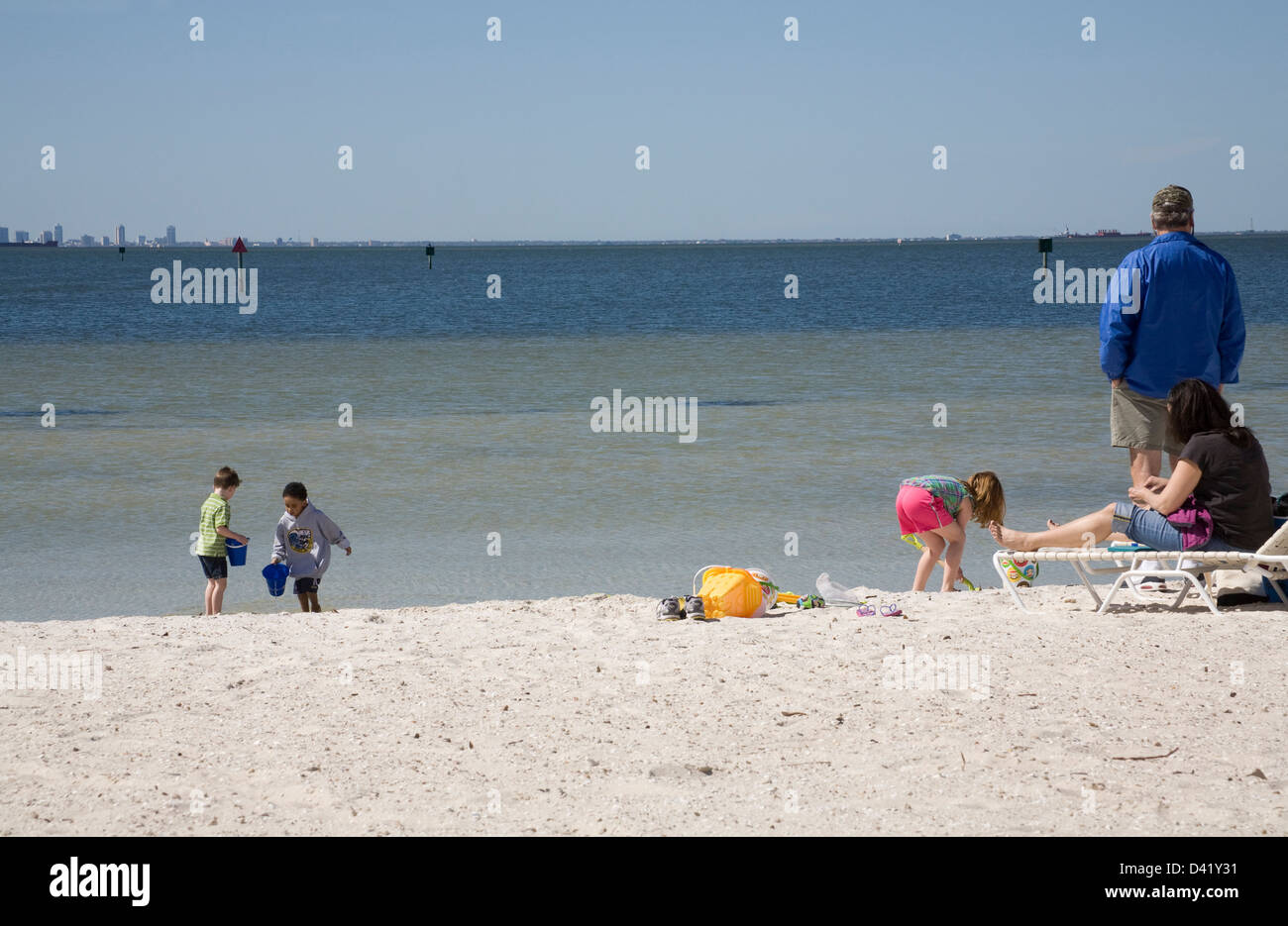 Ruskin Florida USA Man woman and three children on private beach with