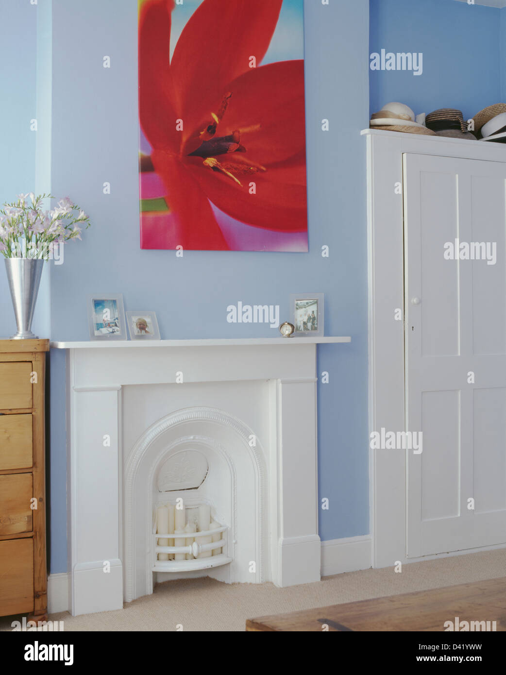 Picture Of Red Tulip Above White Painted Fireplace With