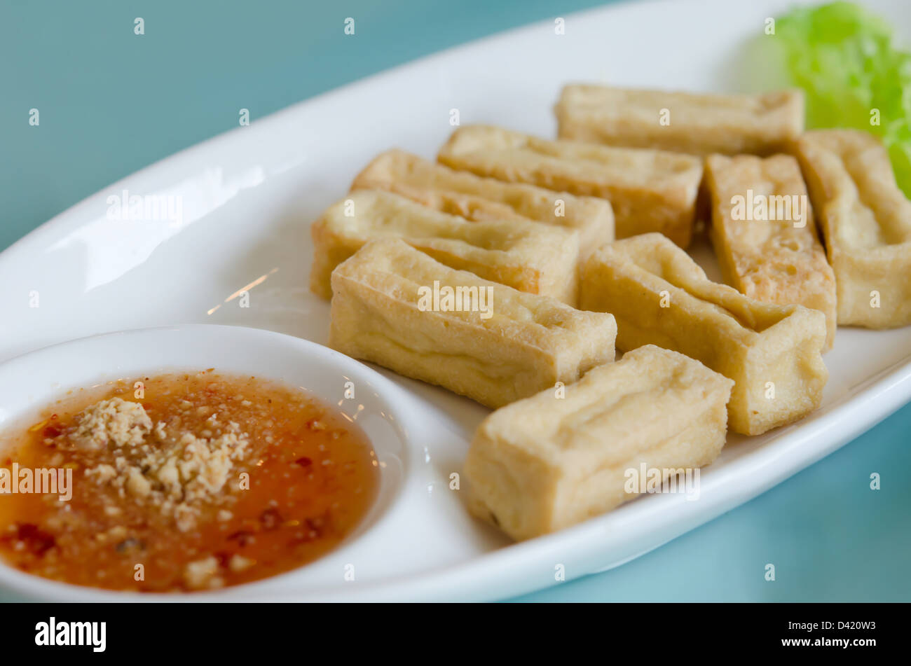 deep fried tofu and fresh vegetable served with spicy sauce Stock Photo