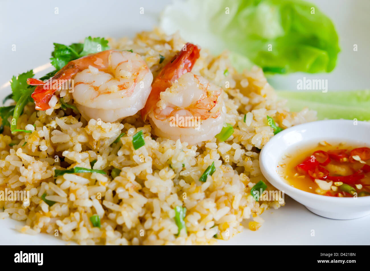 fried rice and shrimp served with spicy sauce and fresh vegetable Stock