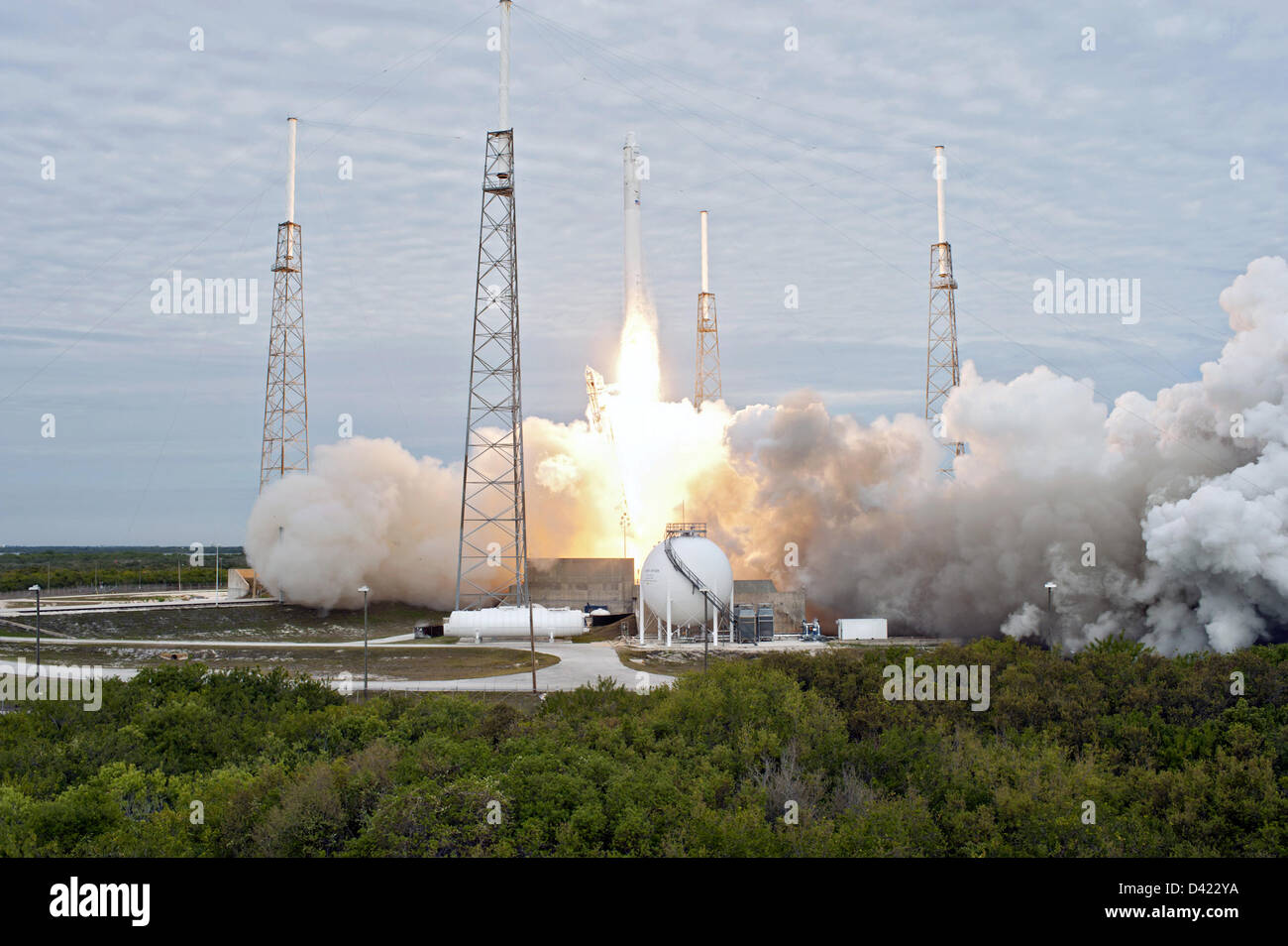The SpaceX Falcon 9 commercial launch rocket blasts off with the Dragon ...