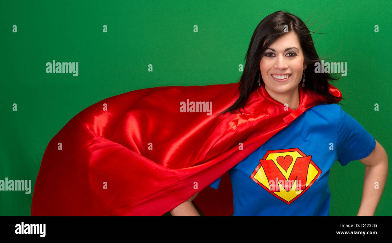 Super Mother in Red Cape With Chest Crest Smiling Stock Photo