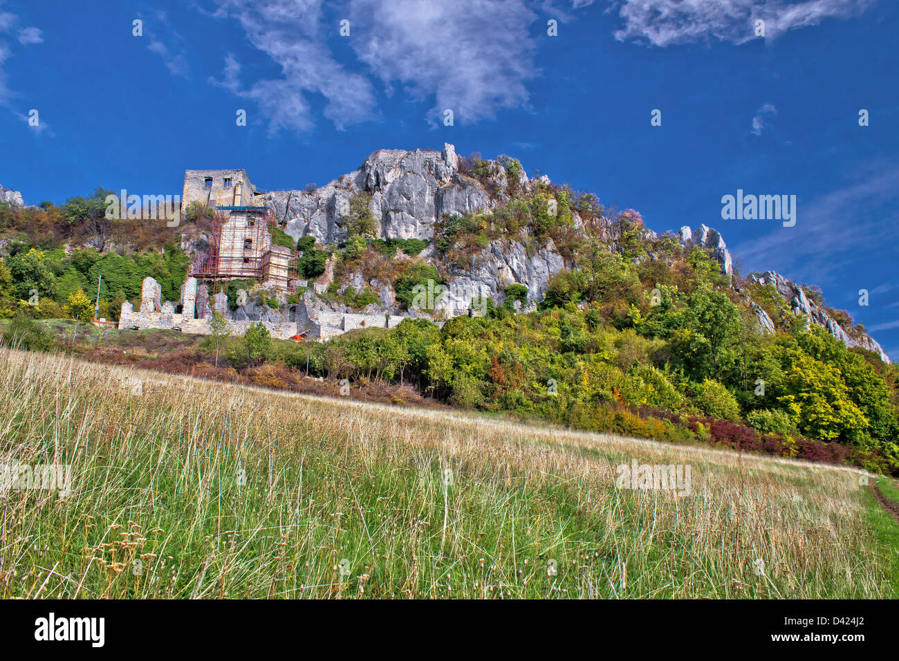 Autumn colors of Kalnik mountain, old fortress on the ridge Stock Photo