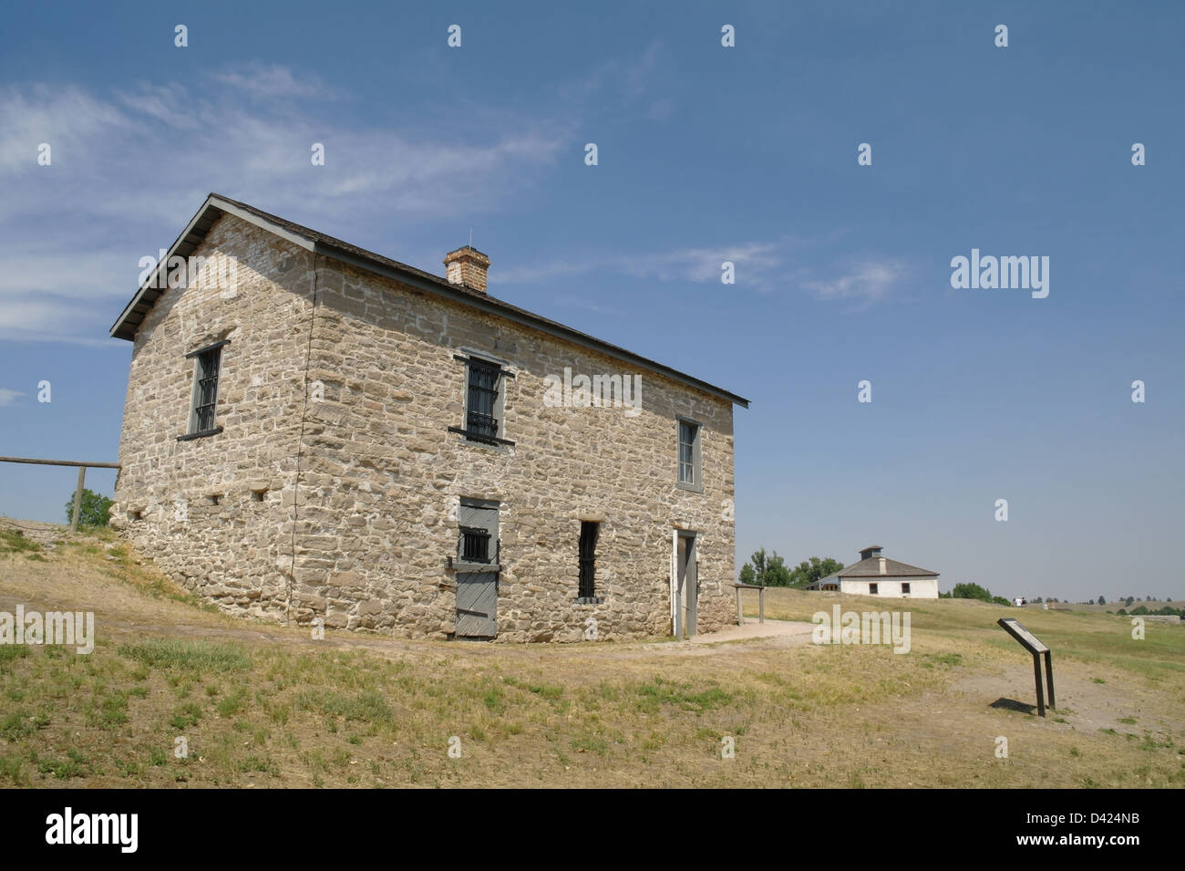 Blue sky view 1866 stone guardhouse building, south side Fort Laramie
