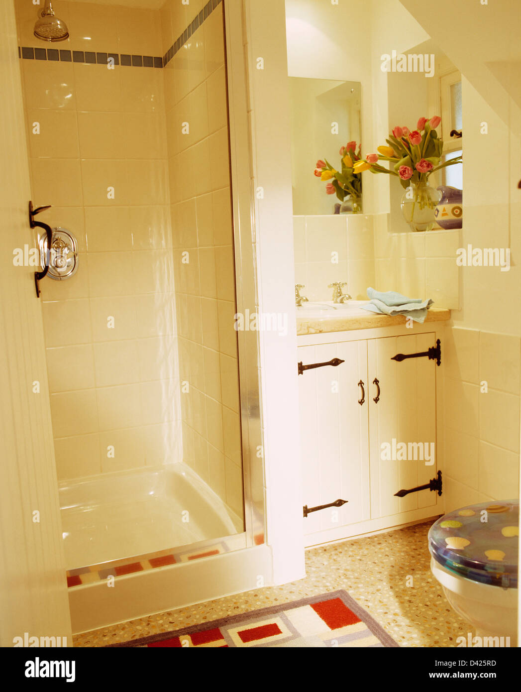 White tiled shower in small coastal bathroom Stock Photo Alamy