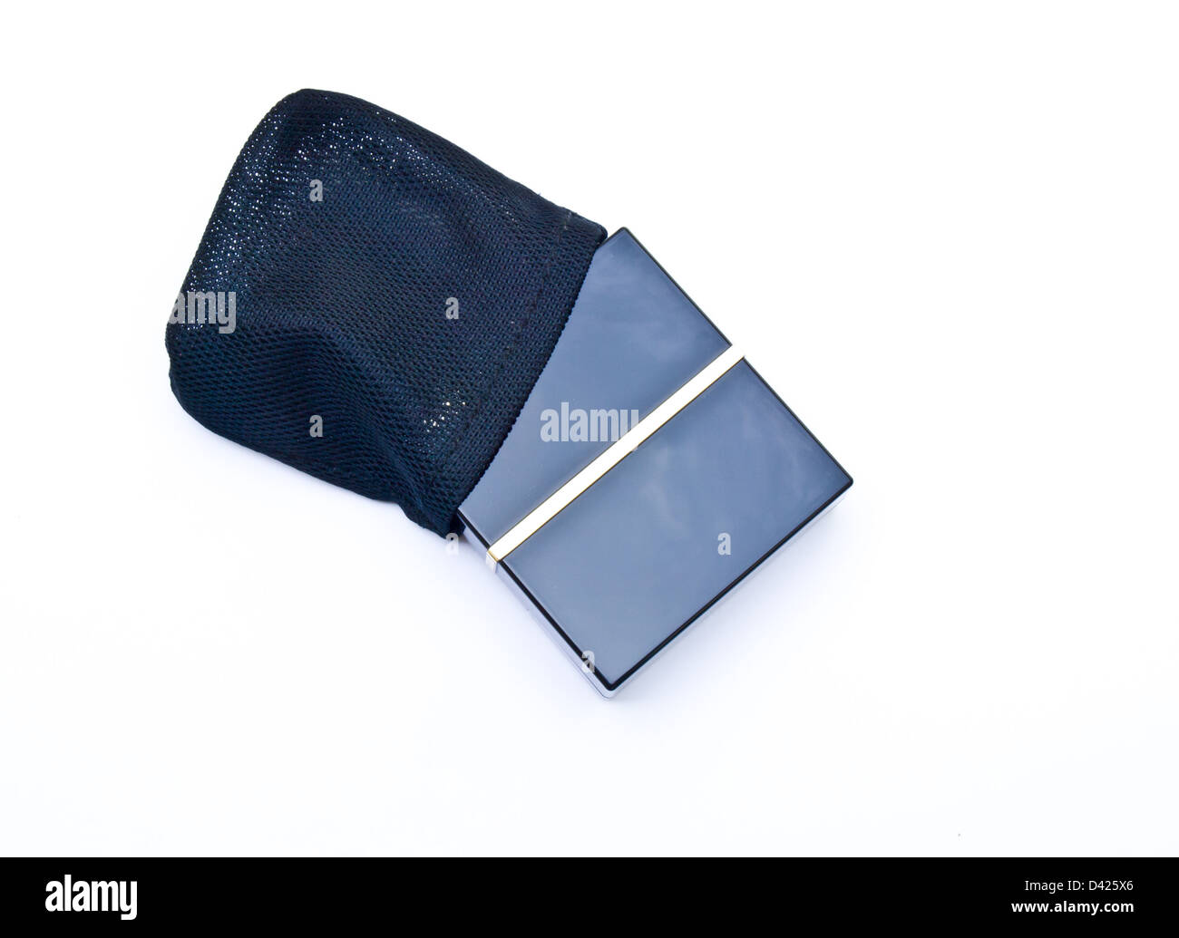 Face powder in a black box and pouch isolated in a white background Stock Photo