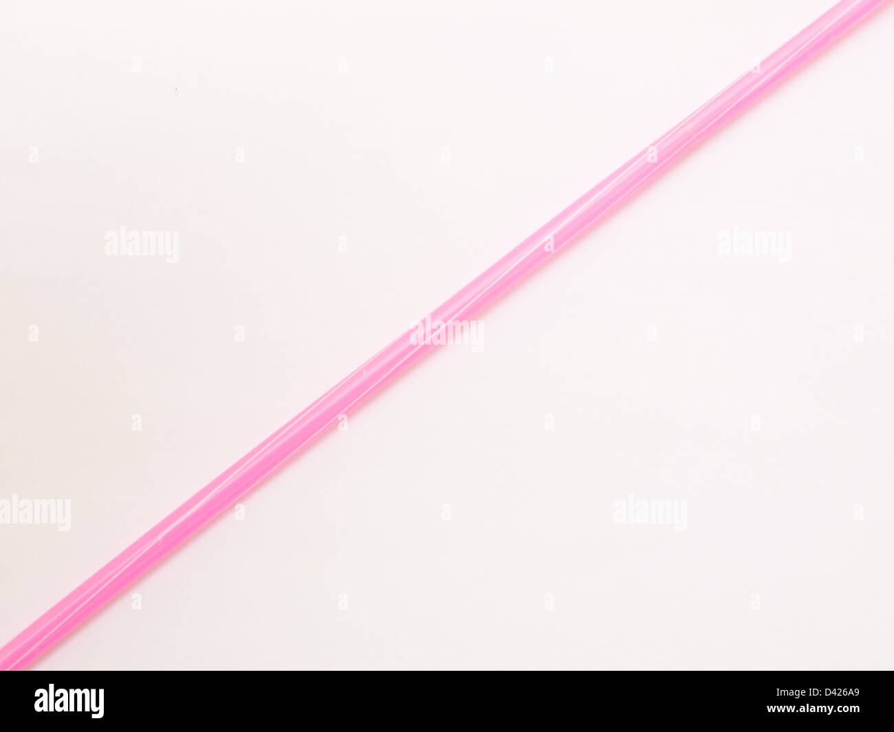 Pink straw isolated on white background Stock Photo - Alamy