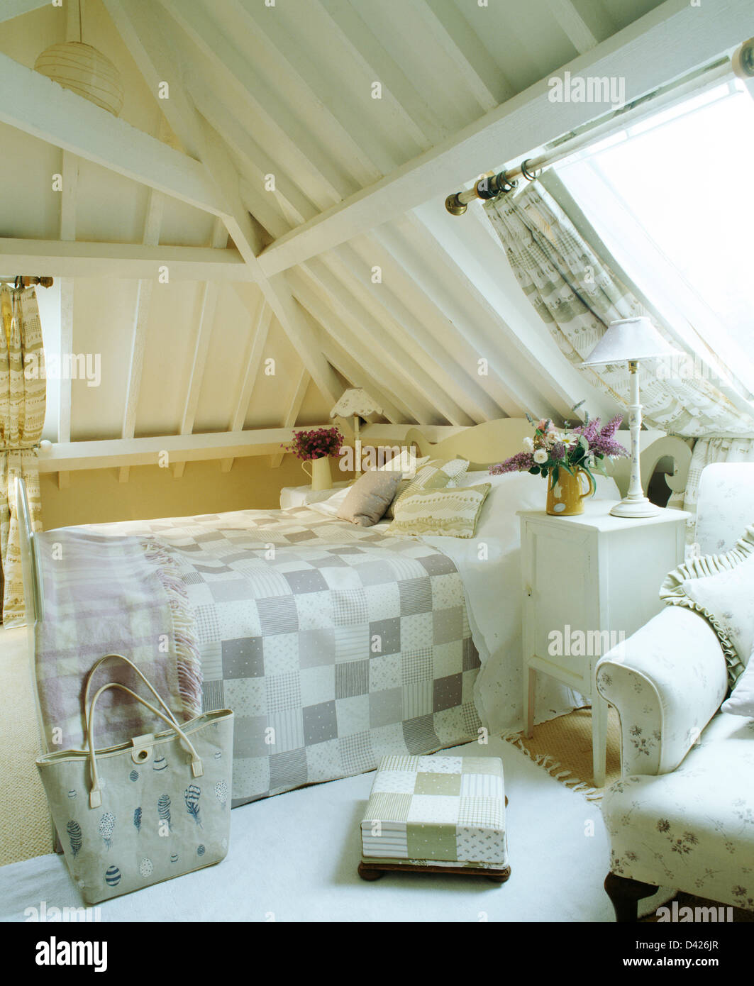 White Painted Beams And Sloping Ceiling In Country Loft