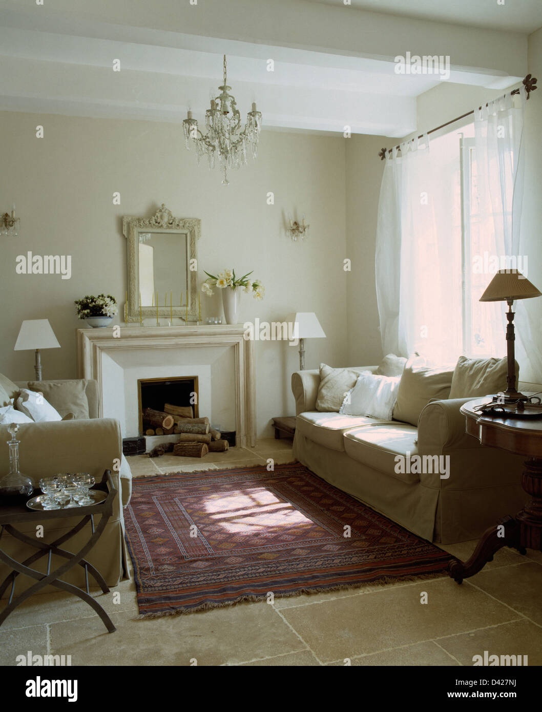 Cream Sofas On Either Side Of Fireplace In French Country Living Room Stock Photo Alamy