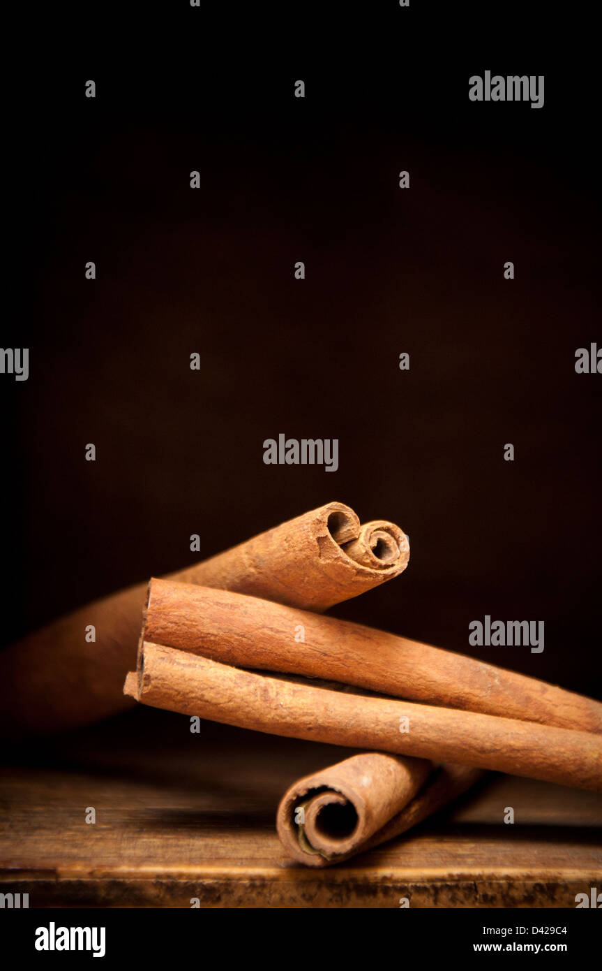 Cinnamon sticks on a wooden shelf Stock Photo Alamy