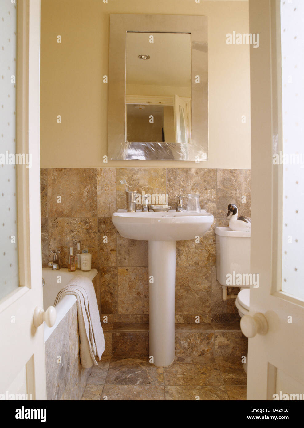 Rectangular Mirror Above Pedestal Basin In Country Bathroom With