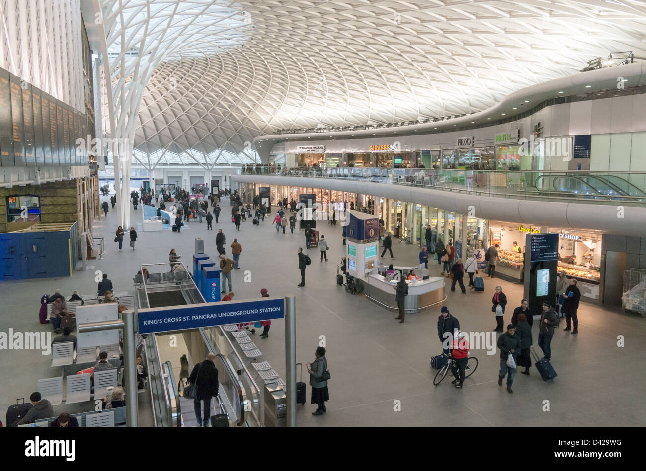 Passengers within the new concourse  of Kings Cross Station, London Stock Photo