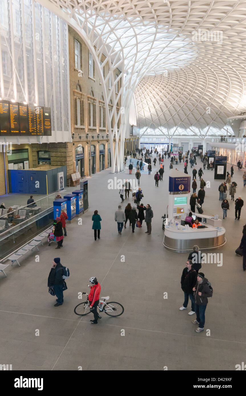 Passengers within the new concourse  of Kings Cross Station, London Stock Photo