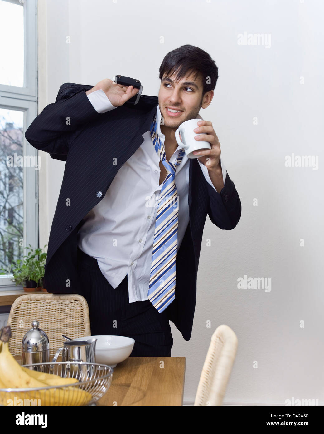A happy suit in a hurry to go to work. Stock Photo