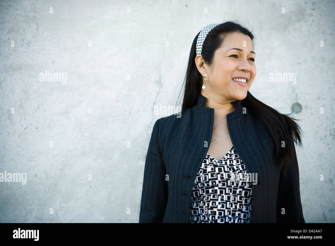 a mid-aged businesswoman self-assured and happy. Stock Photo