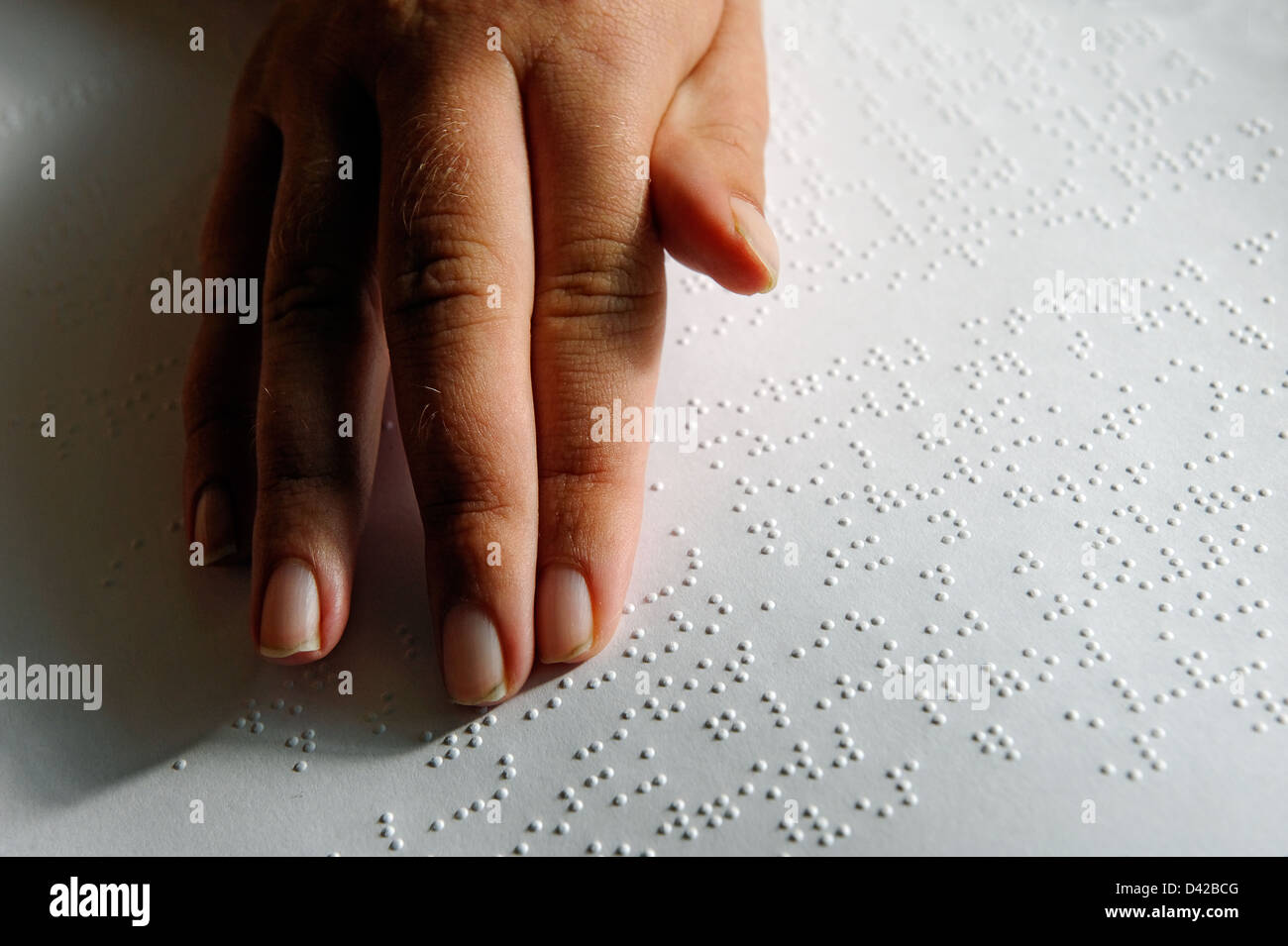 Hand reading braille Stock Photo Alamy