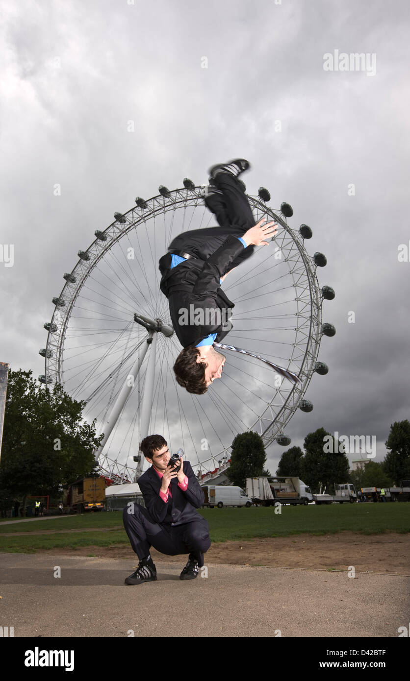 Parkour action at London eye, corporate risk, London Stock Photo