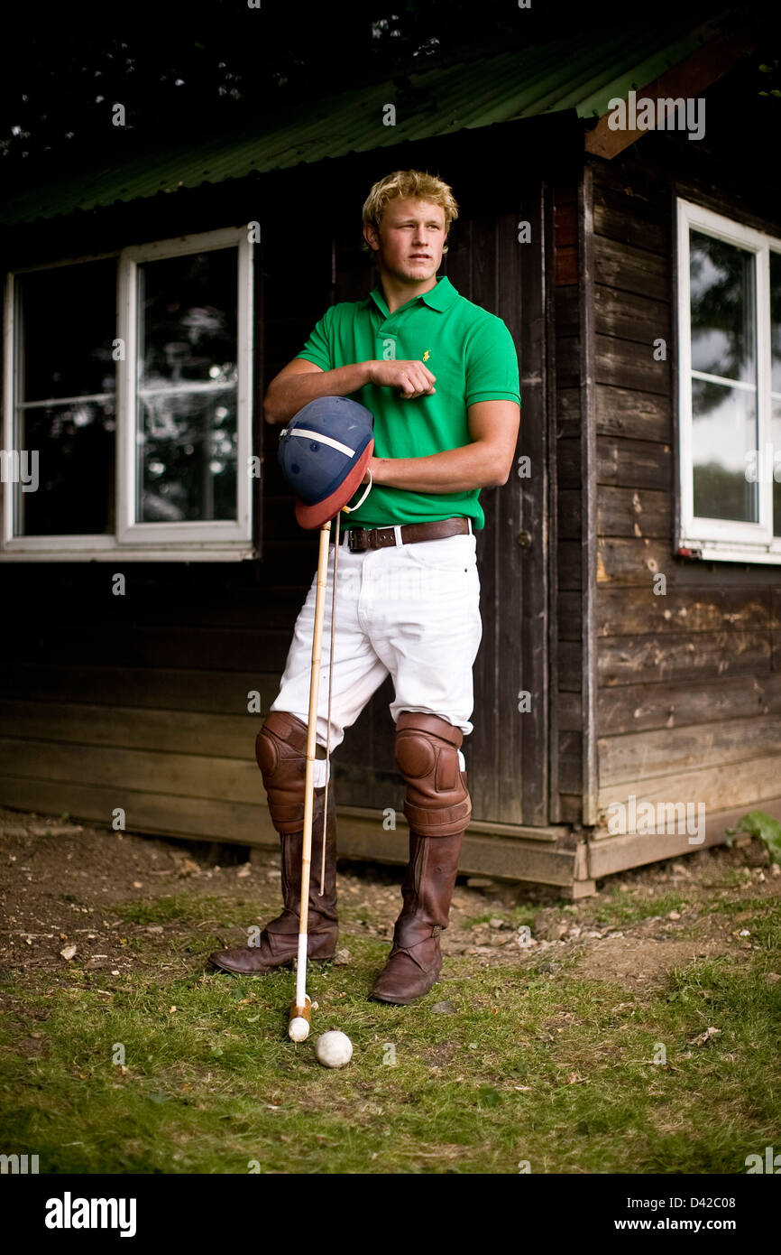 Polo players stands by club house with equipment Stock Photo Alamy