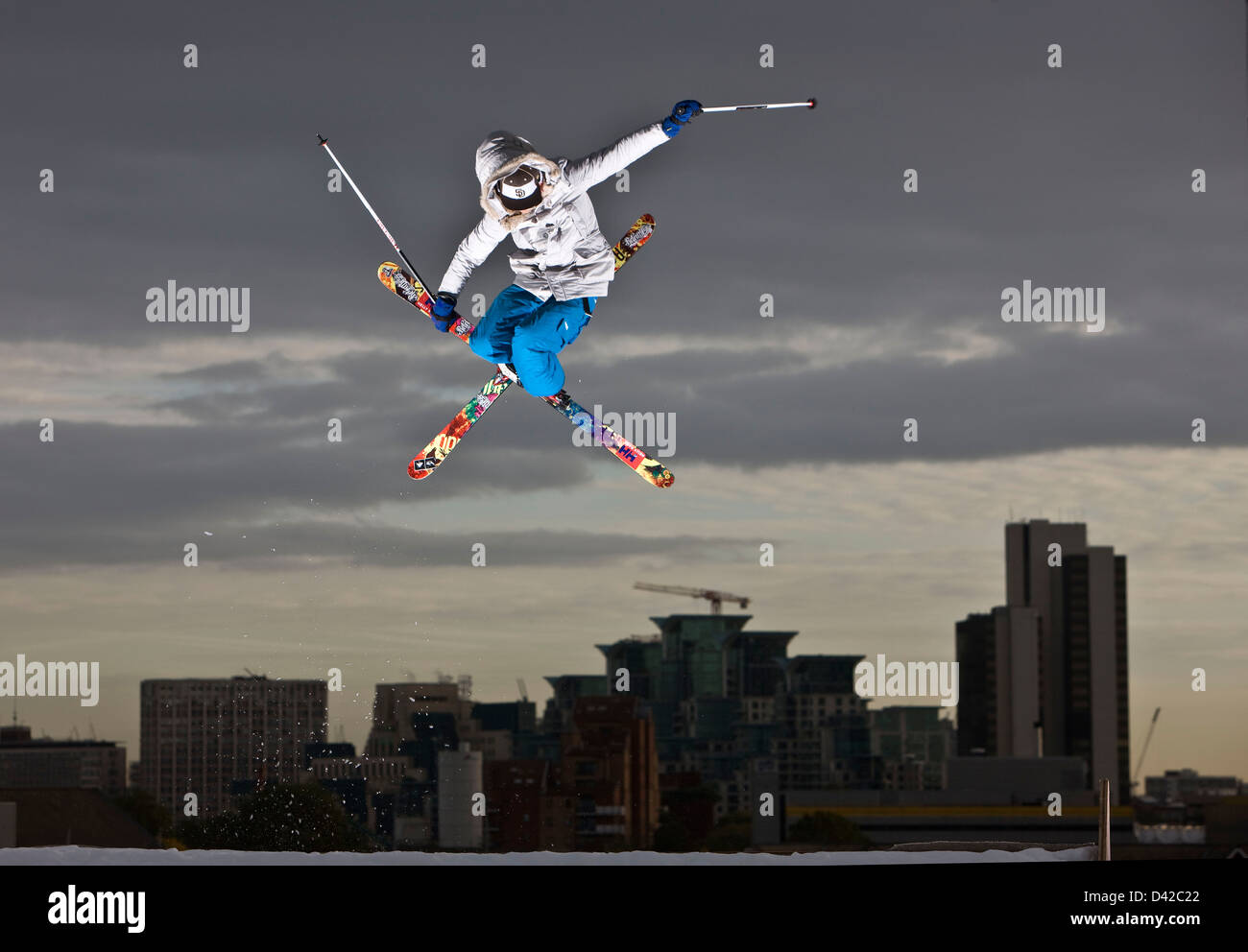 Urban skiing mid air action jump, skis crossed Stock Photo