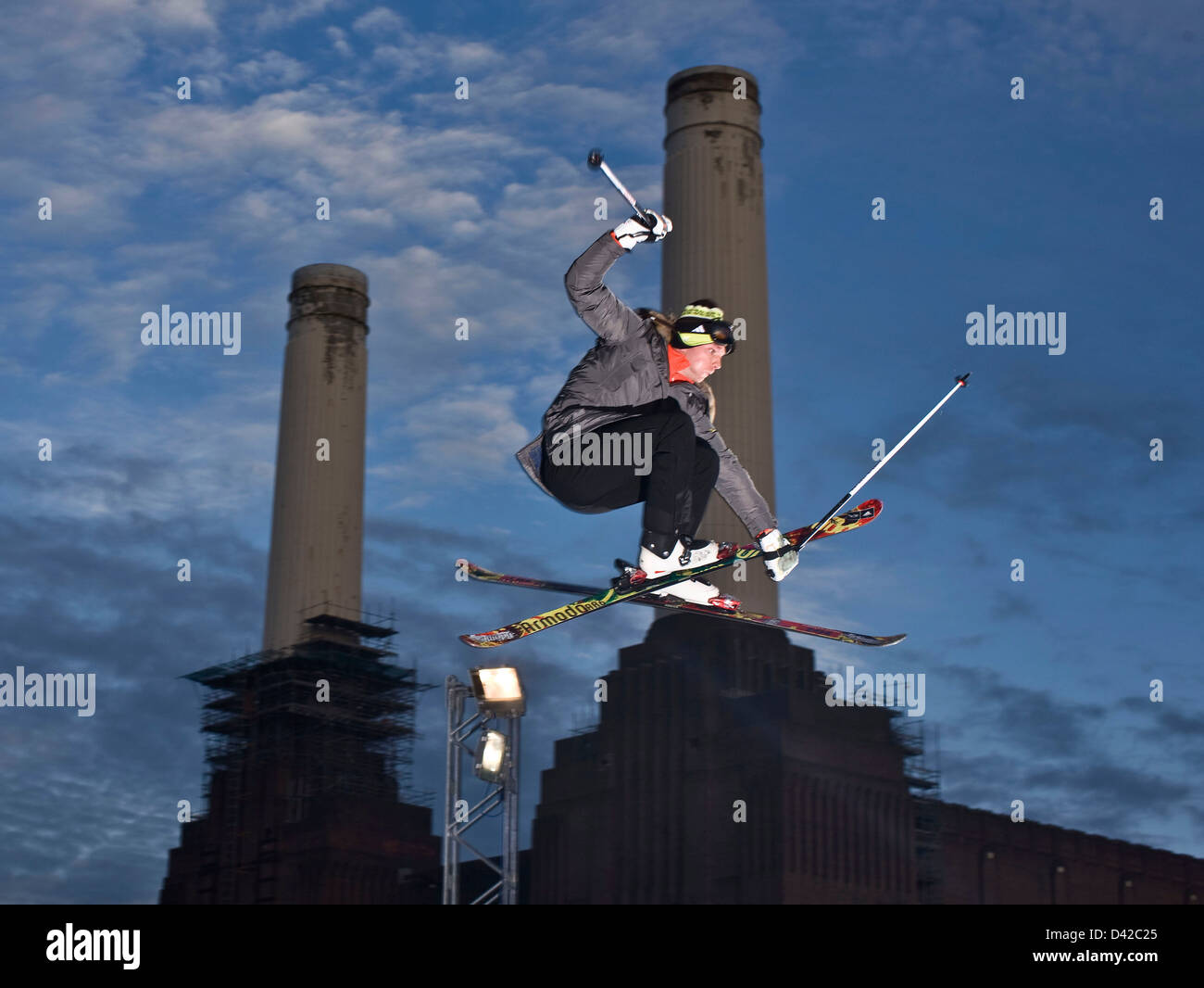 Urban skier in mid air action jump, Battersea power station Stock Photo