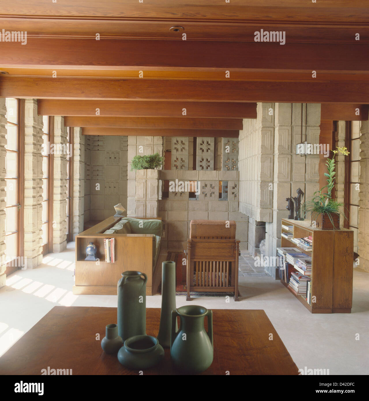 Pale Turquoise Ceramic Vases On Table In Foreground Of Living Room